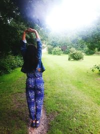 Girl standing on grassy field