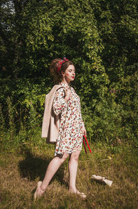 Full length of girl standing on grass