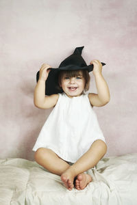 Portrait of cute baby girl in bed