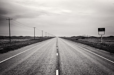 Empty road along landscape