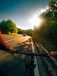 Man riding bicycle on road