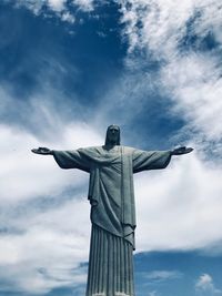 Low angle view of statue against sky