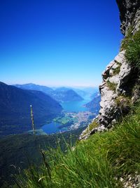 Scenic view of mountains against clear blue sky