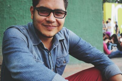 Close-up portrait of young man wearing eyeglasses