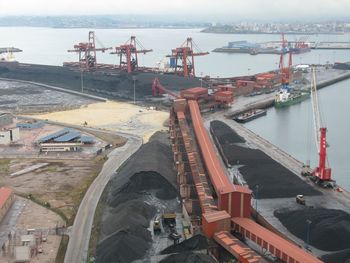 High angle view of coal mine by river