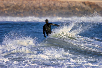 Man surfing in sea