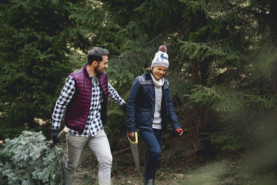 Father and son walking in forest