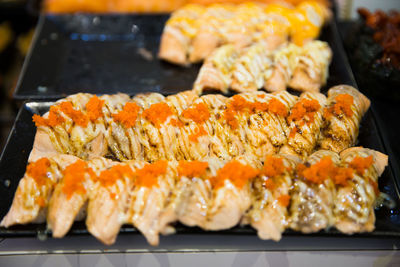 Top view of japanese sushi food, sushi salmon burn nigiri with mayonnaise