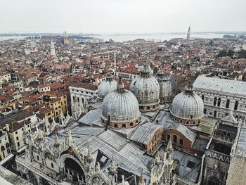 High angle view of city buildings against sky