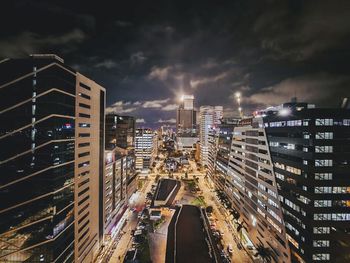 High angle view of illuminated buildings in city at night