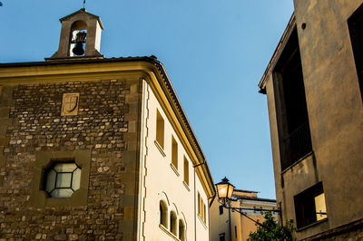 Low angle view of building against blue sky