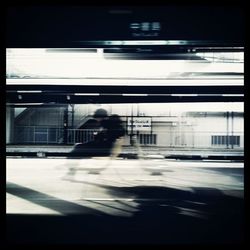 Blurred motion of man in train