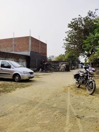 Car parked on street against buildings