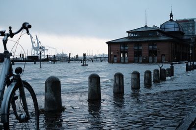 Panoramic view of canal by building against sky