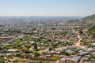 Aerial view of cityscape against sky