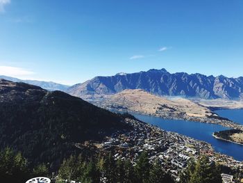 Scenic view of mountains against clear blue sky