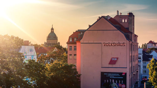 Panoramic view of buildings against sky at sunset