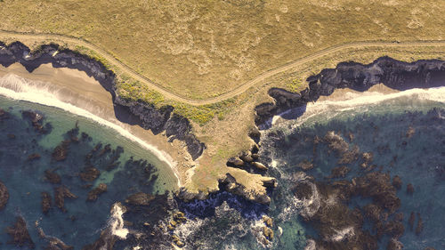 Aerial view of mountain by sea