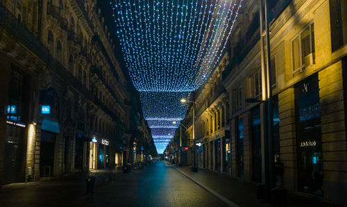 Streets of toulouse by night during the winter holidays   empty street with diminishing perspective