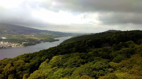 Scenic view of mountains against cloudy sky