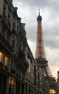 Low angle view of eiffel tower and buildings during sunset 