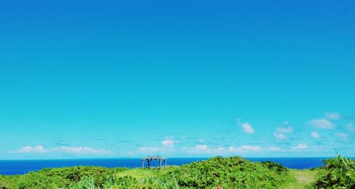 Scenic view of sea against blue sky