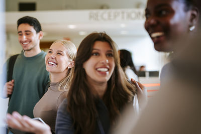 Portrait of young woman sitting at home