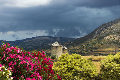 Scenic view of mountains against cloudy sky