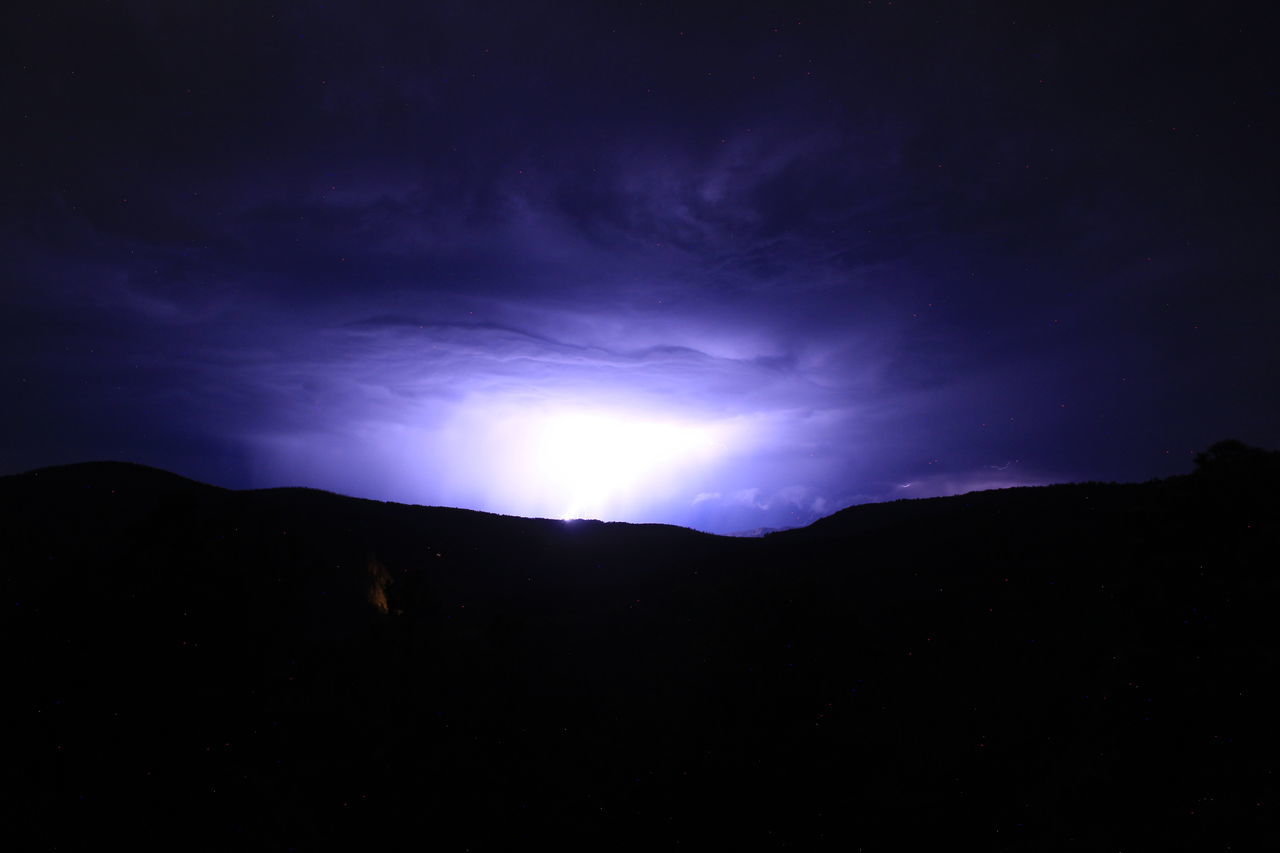 sky, darkness, night, beauty in nature, cloud, scenics - nature, mountain, environment, silhouette, light, moonlight, landscape, nature, dark, dramatic sky, dawn, no people, tranquility, storm, horizon, star, lightning, power in nature, mountain range, tranquil scene, outdoors, awe, land, astronomy