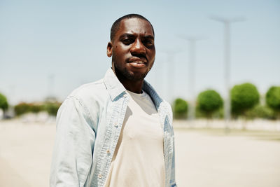 Portrait of young man standing outdoors