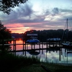 Silhouette of pier on lake