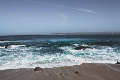 Waves splashing on shore
