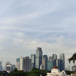 Modern buildings in city against sky