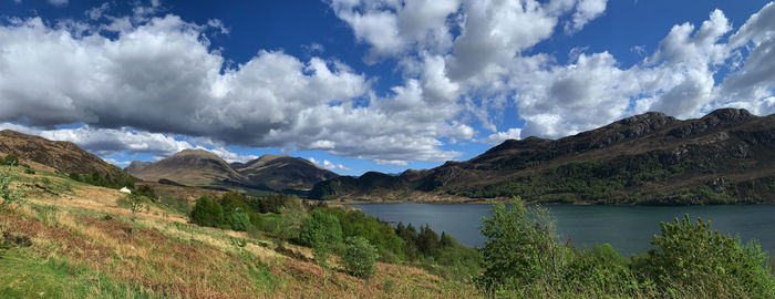 Panoramic view of lake and mountains against sky