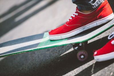 Low section of person skateboarding in park