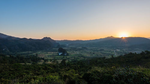 Scenic view of landscape against sky during sunset