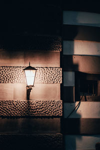 Shadow of street light on wall of building