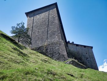 Low angle view of old building against sky