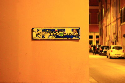 Information sign on street at night