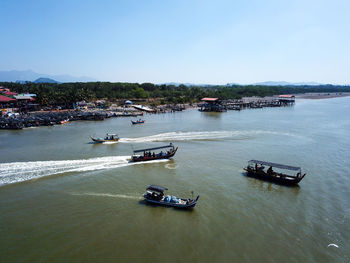 Fishing boat go and back at busy jetty kuala muda.