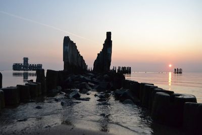 Scenic view of sea against clear sky during sunset