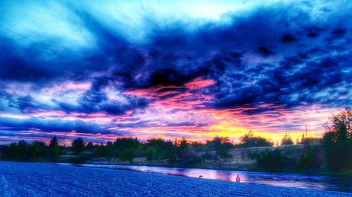 Scenic view of landscape against cloudy sky