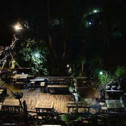 Illuminated chairs at night