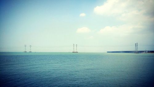 View of suspension bridge over sea