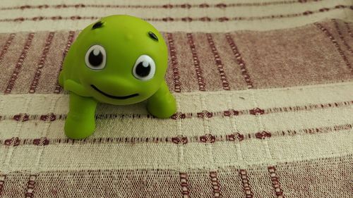 High angle view of stuffed toy on rug