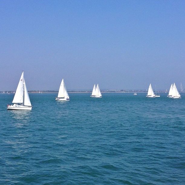 nautical vessel, transportation, boat, mode of transport, water, sea, clear sky, copy space, waterfront, sailboat, moored, blue, sailing, horizon over water, travel, tranquility, tranquil scene, nature, day, beauty in nature