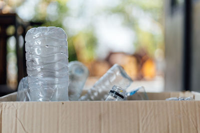 Close-up of glass bottles on table