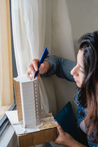 Close-up of woman working at home