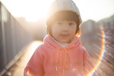 Portrait of cute girl standing outdoors