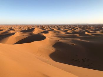 Scenic view of desert against clear sky